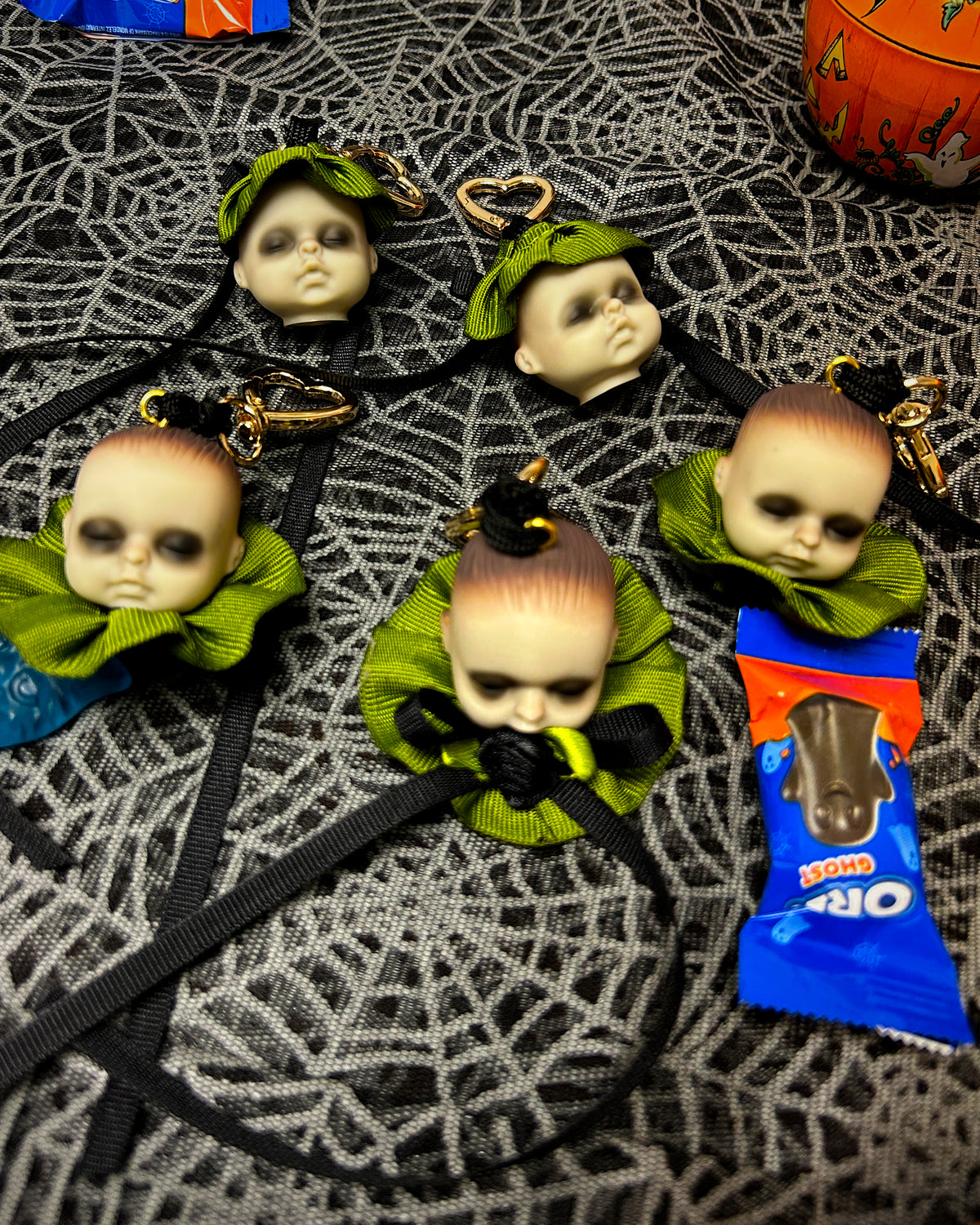 mini babydoll head bag charms